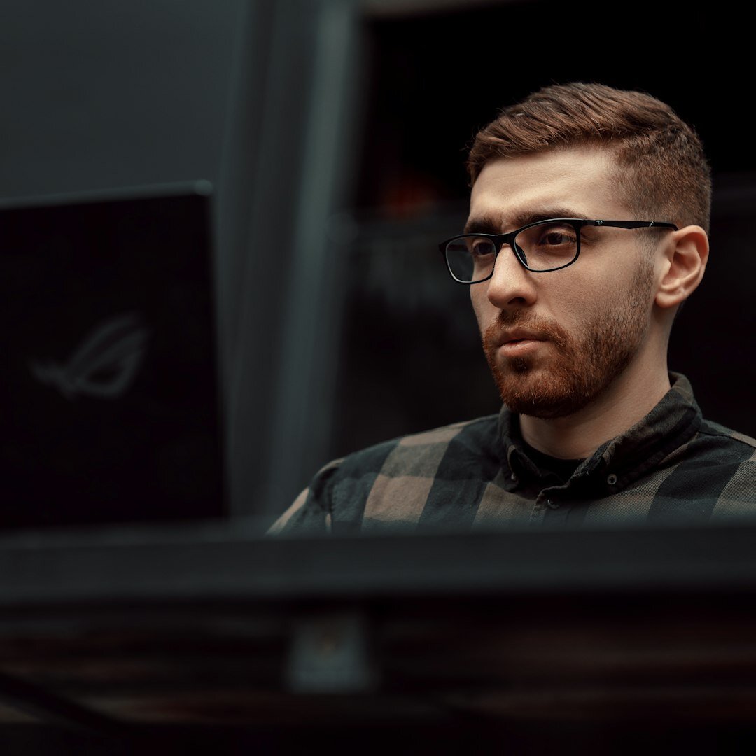 Professional Belgian man with glasses and beard