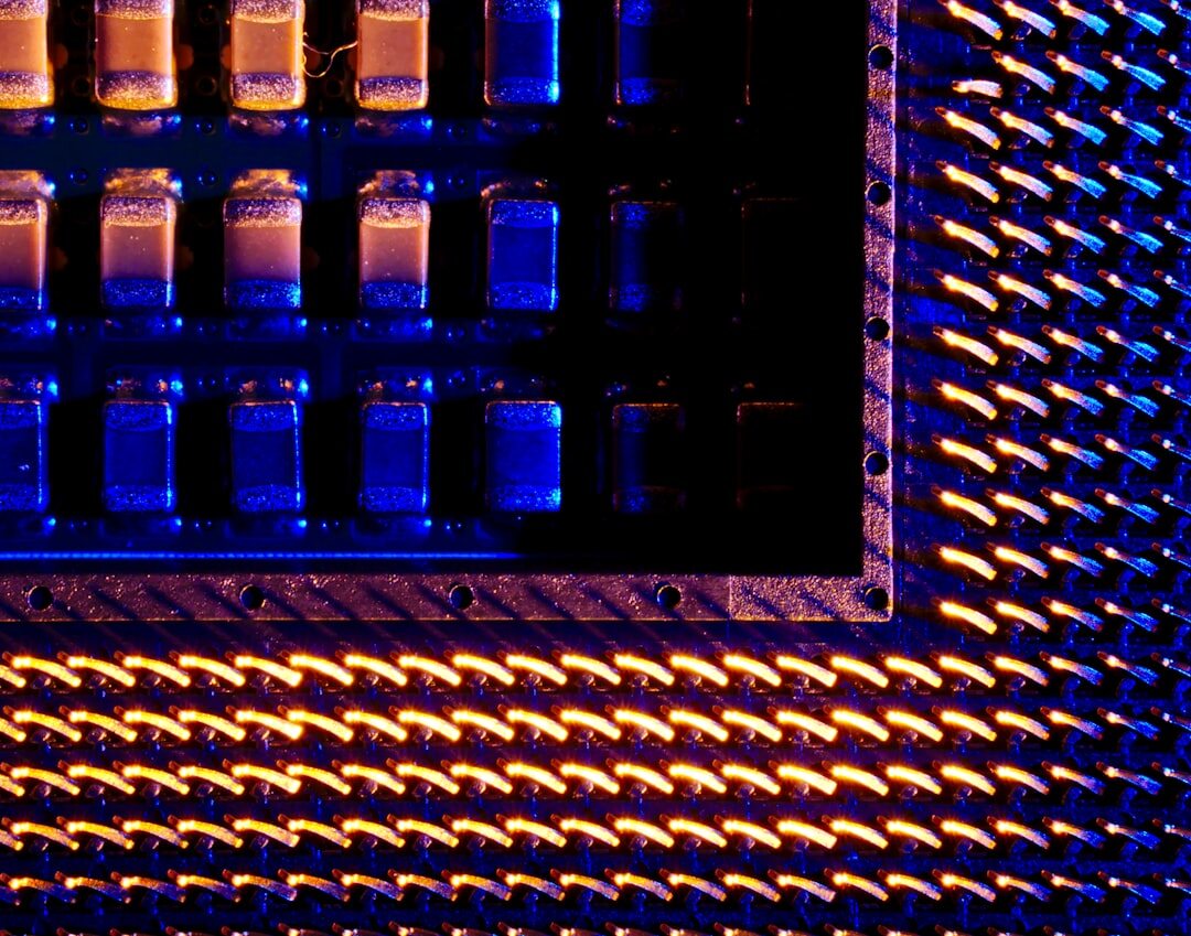 Blue illuminated circuit board with microchips and processors