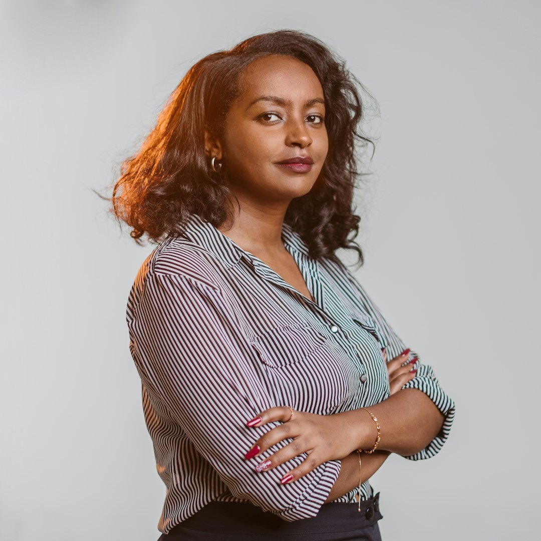 Professional Belgian woman smiling in business attire