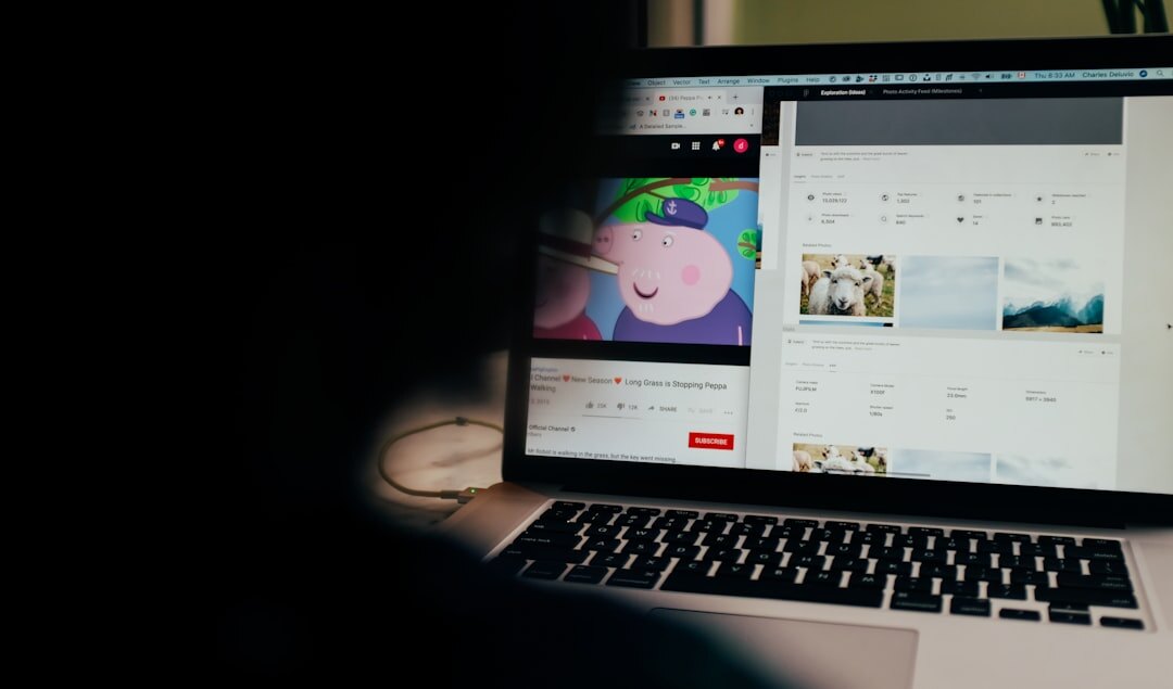 Close up of hands editing video timeline on a laptop