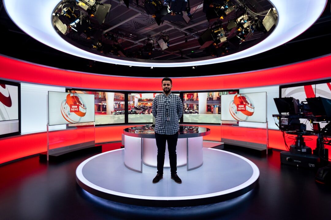 Television news studio with anchor desk and cameras