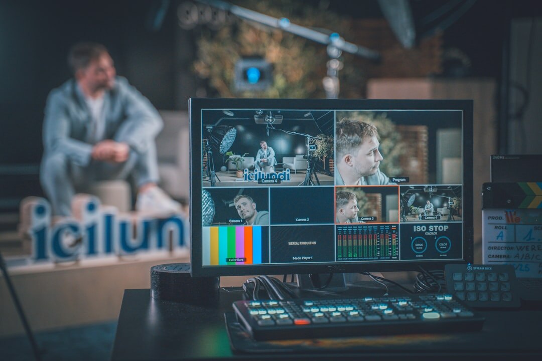 Live television broadcast control room with multiple screens